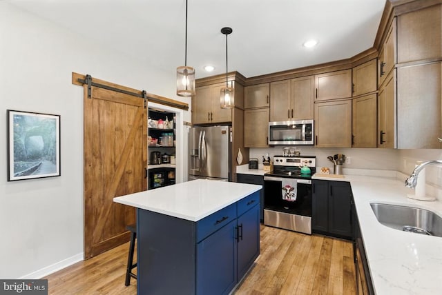 275 Freestyle Ln, Mineral, VA 23117 - kitchen with appliances with stainless steel finishes, light wood-style flooring, a kitchen bar, light countertops, and recessed lighting