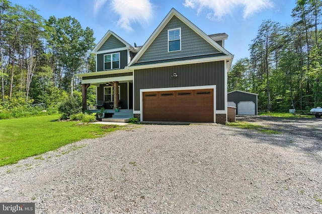 275 Freestyle Ln, Mineral, VA 23117 - view of front of house featuring covered porch, a garage, gravel driveway, and a front yard