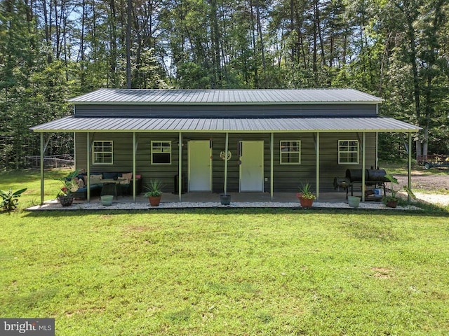 275 Freestyle Ln, Mineral, VA 23117 - view of front of house featuring a front yard, a metal roof, and covered porch