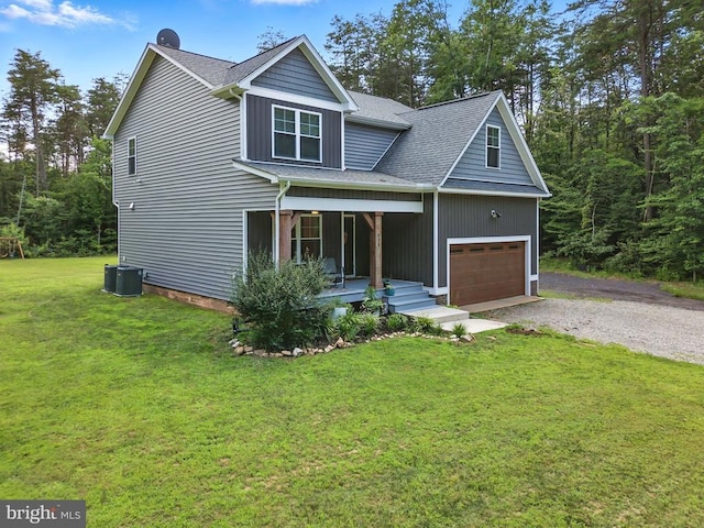 275 Freestyle Ln, Mineral, VA 23117 - view of front facade with a front yard, gravel driveway, a shingled roof, an attached garage, and covered porch
