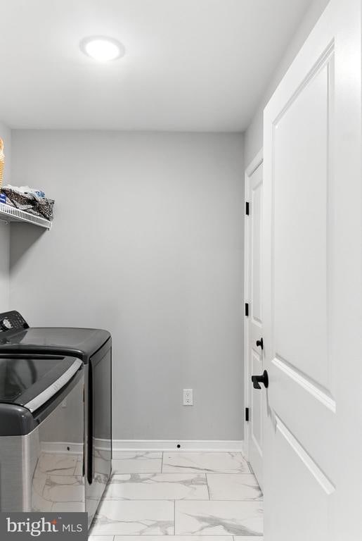 275 Freestyle Ln, Mineral, VA 23117 - washroom featuring washing machine and clothes dryer and light marble finish flooring