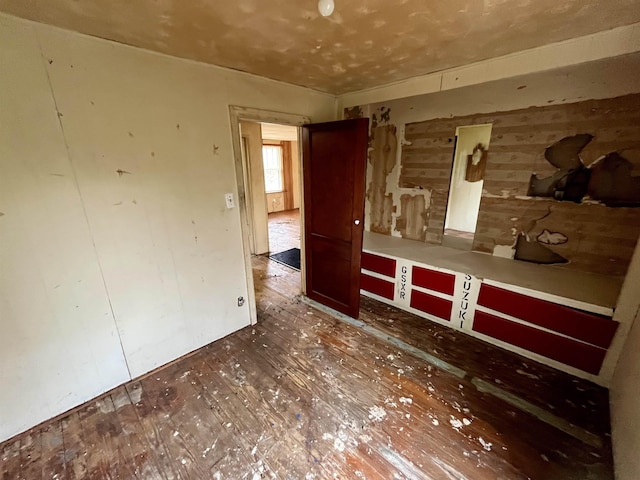 204 Dogwood St, Waynesboro, VA 22980 - empty room featuring wooden walls and hardwood / wood-style floors