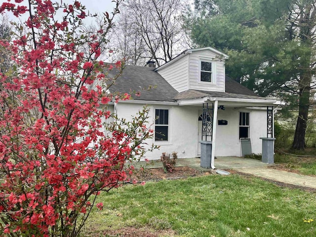 204 Dogwood St, Waynesboro, VA 22980 - view of front of property with a shingled roof, stucco siding, and a front lawn