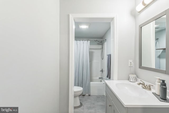 full bathroom featuring toilet, shower / bath combo, and vanity