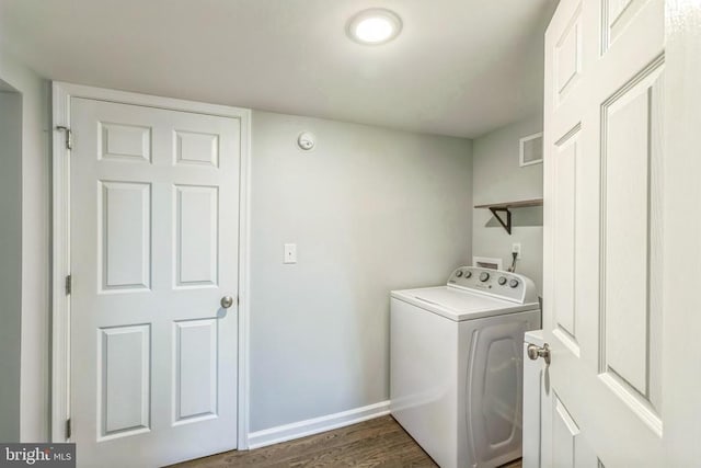laundry room featuring washer / clothes dryer, baseboards, visible vents, wood finished floors, and laundry area