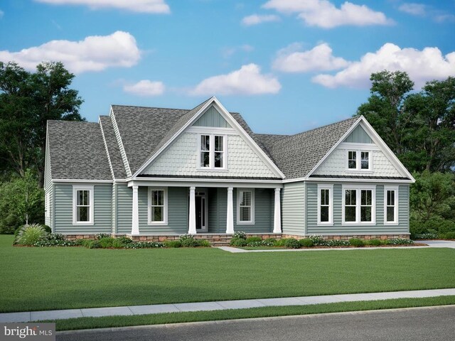 view of front of house featuring a front lawn, covered porch, and roof with shingles