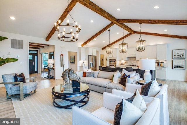 living area with a chandelier, light wood-style flooring, and recessed lighting