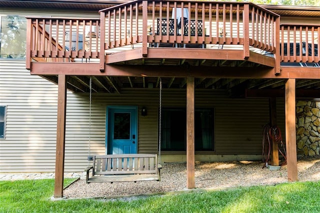 back of property with a wooden deck