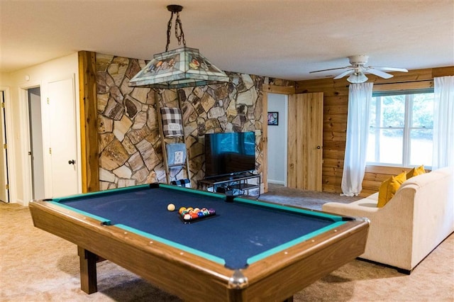 game room with a ceiling fan, carpet flooring, wood walls, and billiards
