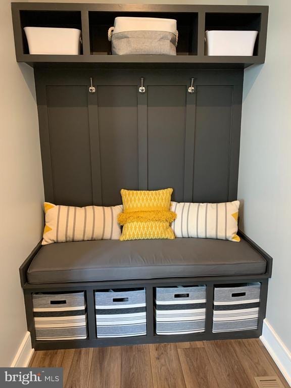  - mudroom featuring baseboards and wood finished floors