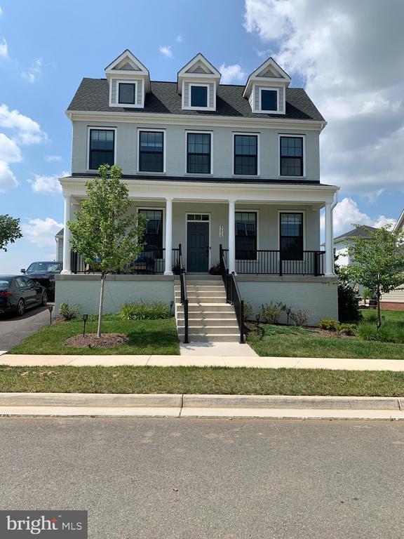  - view of front of house with a porch and stairs