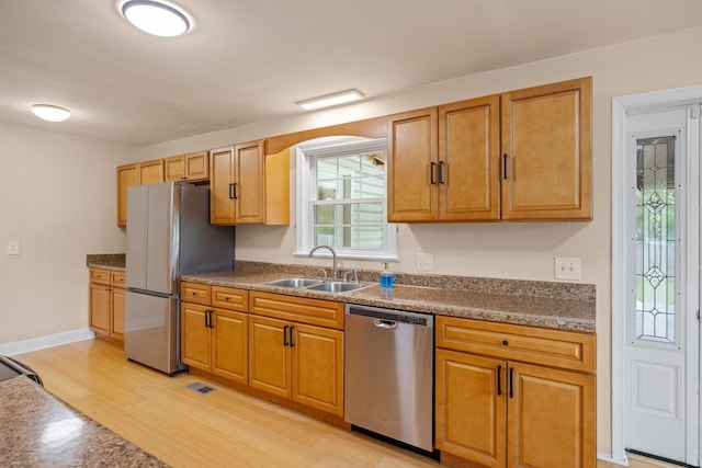 475 Hartman Dr, Harrisonburg, VA 22802 - kitchen featuring stainless steel appliances, plenty of natural light, dark countertops, and light wood-style floors
