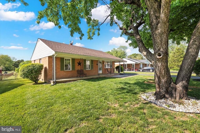 316 Grove Ave, Gordonsville, VA 22942 - rear view of property with a yard, brick siding, and a porch