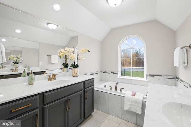 7806 Shawmont Rd, Fredericksburg, VA 22407 - full bathroom with vanity, lofted ceiling, marble look tiles, and a bath