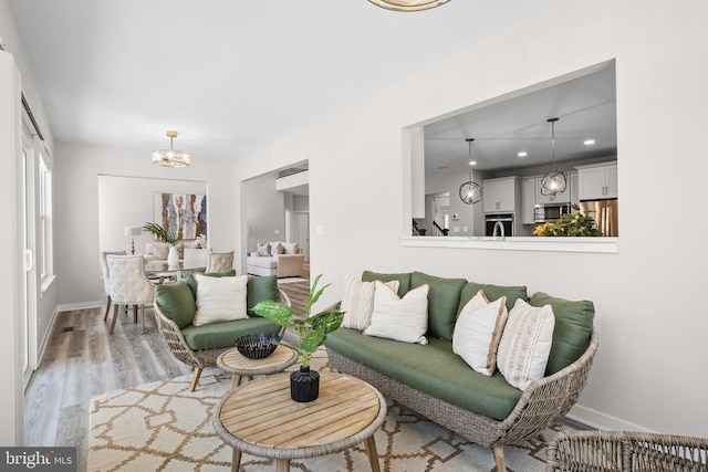 7806 Shawmont Rd, Fredericksburg, VA 22407 - living room featuring a chandelier, light wood-type flooring, baseboards, and recessed lighting
