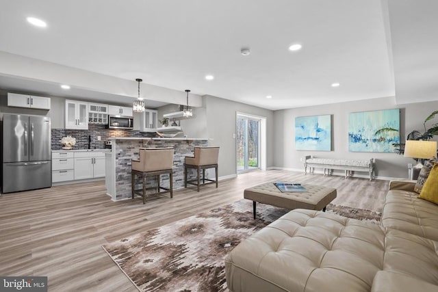 7806 Shawmont Rd, Fredericksburg, VA 22407 - living room featuring light wood finished floors, recessed lighting, and baseboards