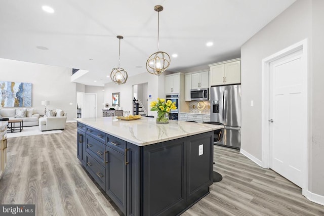 7806 Shawmont Rd, Fredericksburg, VA 22407 - kitchen featuring appliances with stainless steel finishes, white cabinetry, light wood-style floors, recessed lighting, and a chandelier