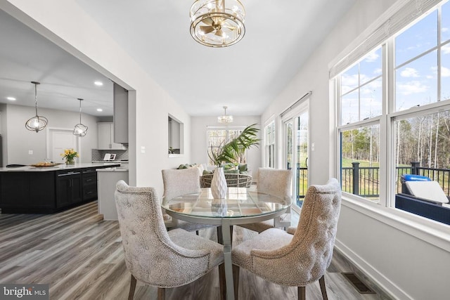 7806 Shawmont Rd, Fredericksburg, VA 22407 - dining room featuring a chandelier, healthy amount of natural light, light wood-type flooring, and recessed lighting