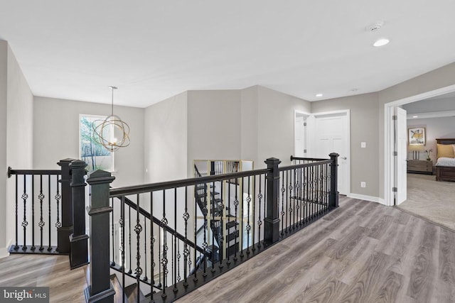 7806 Shawmont Rd, Fredericksburg, VA 22407 - hallway featuring an upstairs landing, wood finished floors, a chandelier, baseboards, and recessed lighting
