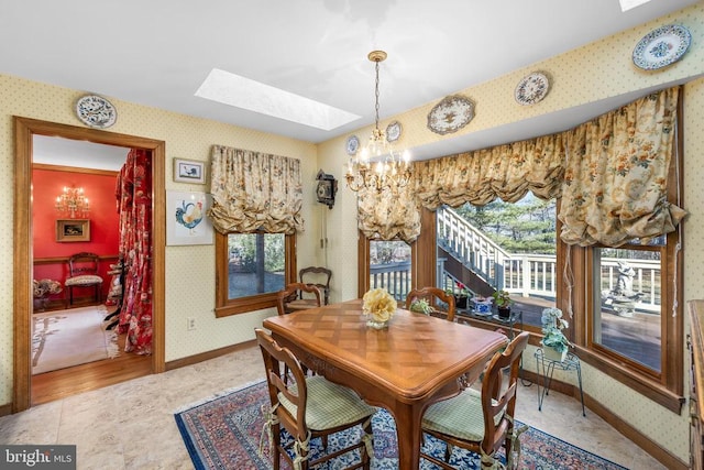 8413 Pathfinders Ct, Spotsylvania, VA 22553 - dining area featuring wallpapered walls, baseboards, a skylight, and an inviting chandelier