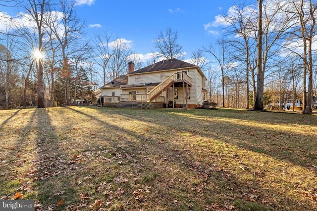 8413 Pathfinders Ct, Spotsylvania, VA 22553 - back of property featuring a yard, a chimney, and a wooden deck
