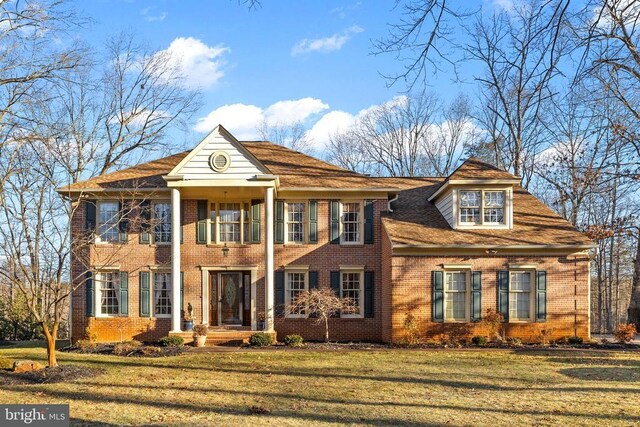8413 Pathfinders Ct, Spotsylvania, VA 22553 - neoclassical home with brick siding and a front lawn