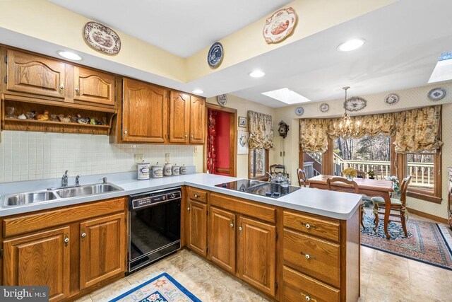 8413 Pathfinders Ct, Spotsylvania, VA 22553 - kitchen featuring a sink, a peninsula, black appliances, light countertops, and a notable chandelier