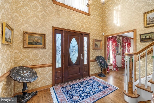 8413 Pathfinders Ct, Spotsylvania, VA 22553 - foyer with a healthy amount of sunlight, stairs, and wallpapered walls