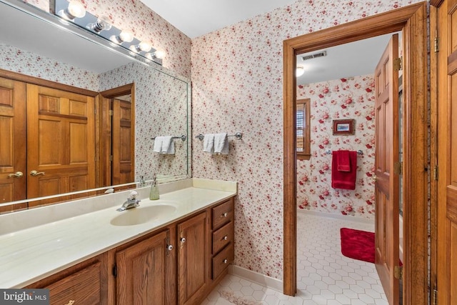 8413 Pathfinders Ct, Spotsylvania, VA 22553 - full bath featuring vanity, visible vents, tile patterned floors, baseboards, and wallpapered walls