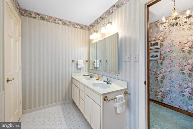 8413 Pathfinders Ct, Spotsylvania, VA 22553 - bathroom with wallpapered walls, a chandelier, and a sink