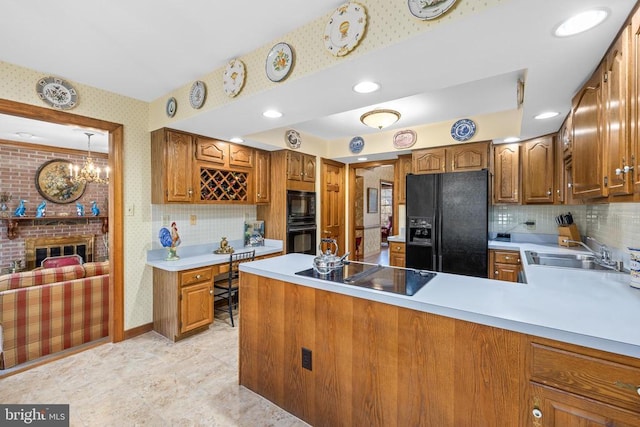 8413 Pathfinders Ct, Spotsylvania, VA 22553 - kitchen featuring wallpapered walls, light countertops, brown cabinets, and black appliances