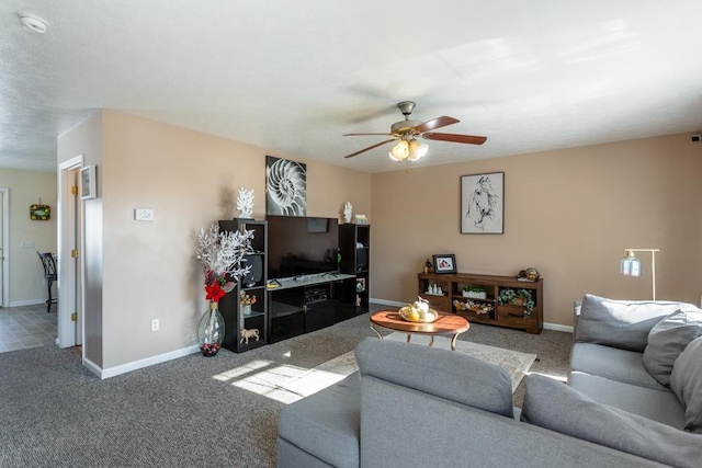 living room with ceiling fan and carpet