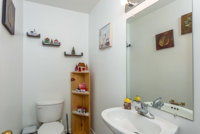 bathroom featuring sink and toilet