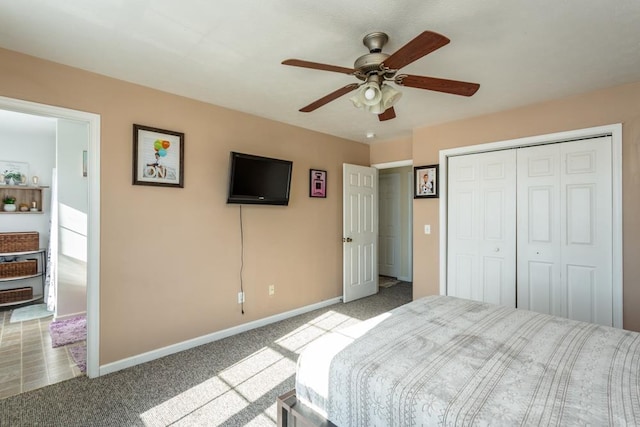 bedroom with light carpet, ceiling fan, and a closet