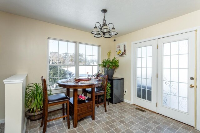 dining space featuring a chandelier