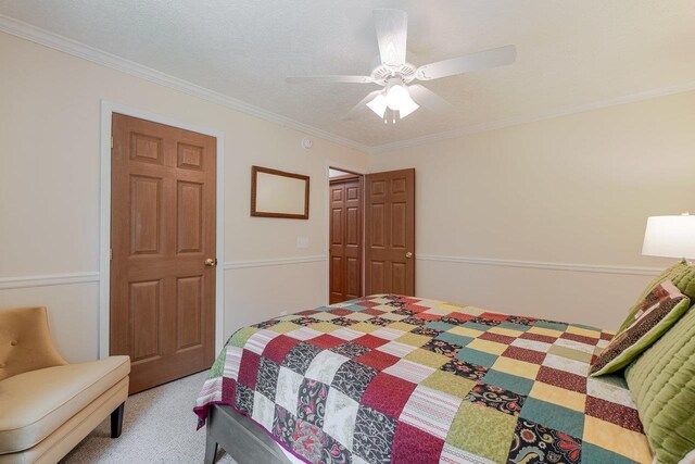 4201 Brown Mountain Ln, Elkton, VA 22827 - bedroom with light carpet, ornamental molding, and a ceiling fan