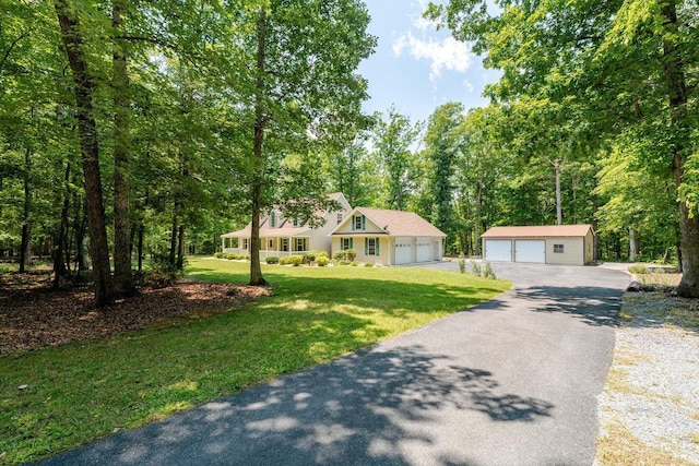 4201 Brown Mountain Ln, Elkton, VA 22827 - view of front of home featuring a garage, a front lawn, an outdoor structure, and view of wooded area