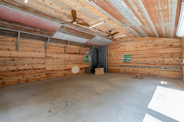 4201 Brown Mountain Ln, Elkton, VA 22827 - misc room with vaulted ceiling, wood walls, concrete floors, and ceiling fan