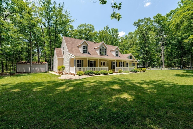 4201 Brown Mountain Ln, Elkton, VA 22827 - cape cod-style house with a porch, a front lawn, and view of wooded area