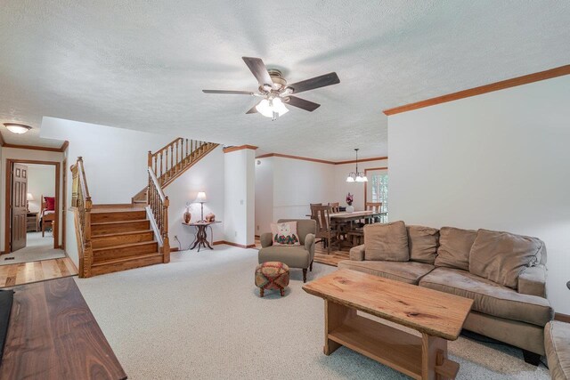 4201 Brown Mountain Ln, Elkton, VA 22827 - carpeted living area featuring ornamental molding, ceiling fan, a textured ceiling, stairway, and a chandelier