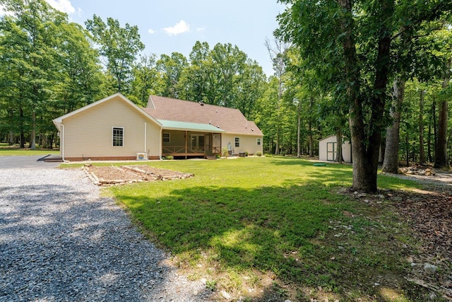 4201 Brown Mountain Ln, Elkton, VA 22827 - view of front facade with a shed, a front yard, and covered porch