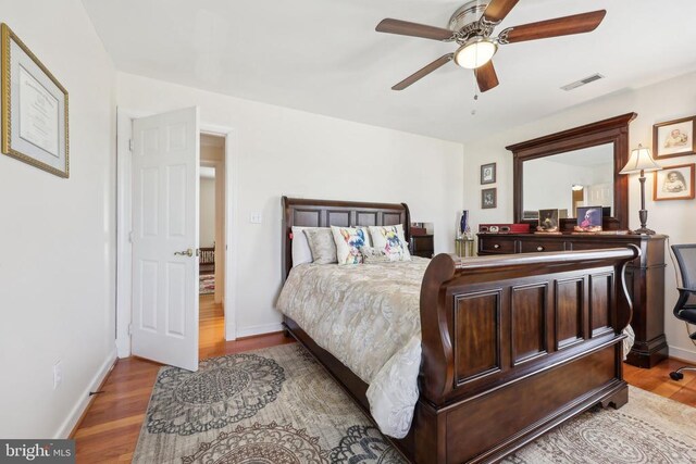 12011 Big Ben Blvd, Fredericksburg, VA 22407 - bedroom featuring wood finished floors, baseboards, and a ceiling fan