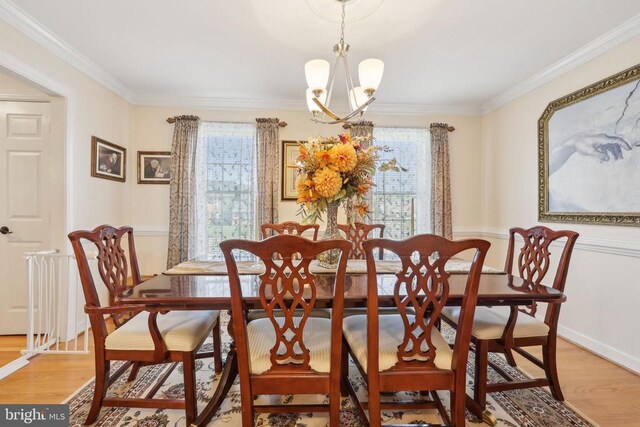 12011 Big Ben Blvd, Fredericksburg, VA 22407 - dining room with a chandelier, crown molding, light wood-type flooring, and baseboards