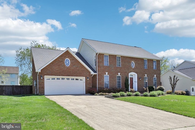 12011 Big Ben Blvd, Fredericksburg, VA 22407 - colonial home featuring a garage, driveway, and brick siding