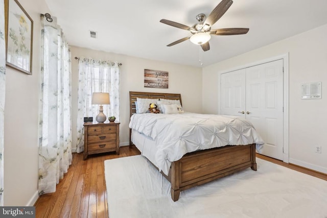 12011 Big Ben Blvd, Fredericksburg, VA 22407 - bedroom with a closet, hardwood / wood-style flooring, a ceiling fan, and baseboards