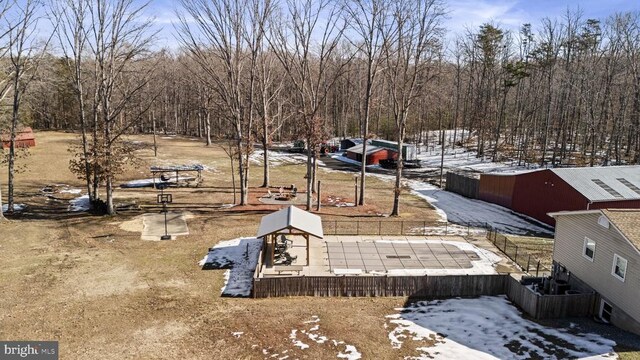 yard covered in snow featuring a gazebo