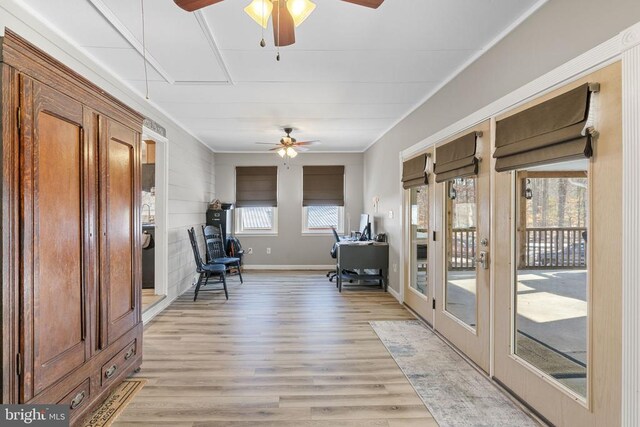 unfurnished room with ceiling fan and light wood-type flooring