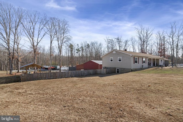 view of home's exterior with a lawn