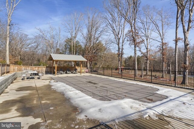 view of swimming pool featuring a gazebo and a patio