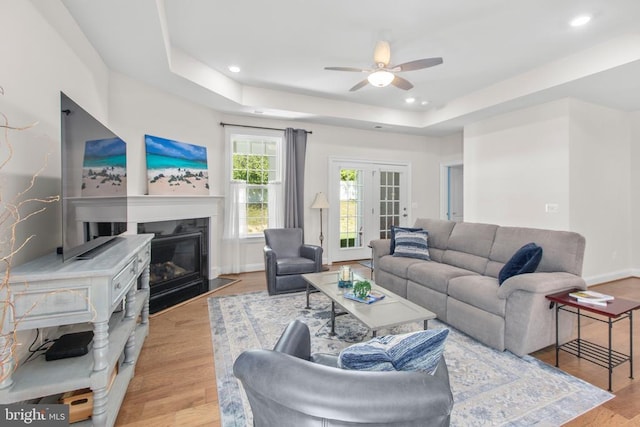 6104 New Berne Rd, Fredericksburg, VA 22407 - living room featuring a ceiling fan, a raised ceiling, light wood finished floors, a fireplace with flush hearth, and recessed lighting